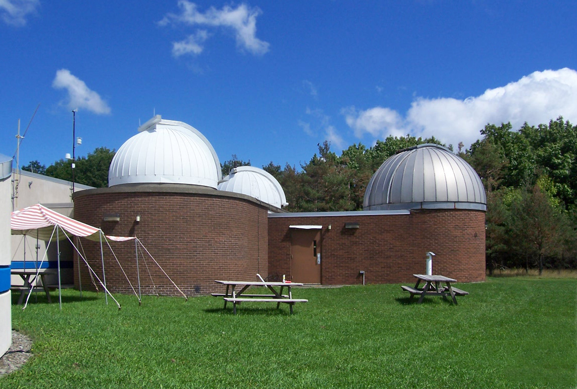 The white observatory domes of the Kopernik Observatory and Science Center in Vestal.